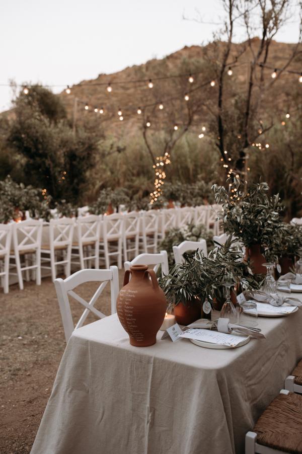 Greek wedding, Greek island, Serifos, wedding venue, nature, wedding decoration, tablesetting, string lights, ceramic vases, olive branches 