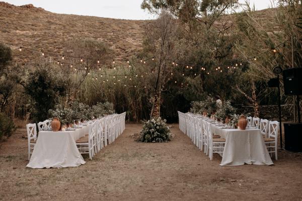 Greek wedding, Greek island, Serifos, wedding venue, nature, wedding decoration, tablesetting, string lights, ceramic vases, olive branches 