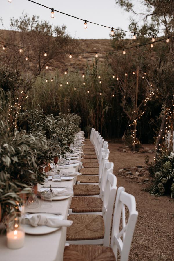 Greek wedding, Greek island, Serifos, wedding venue, nature, wedding decoration, tablesetting, string lights, ceramic vases, olive branches 